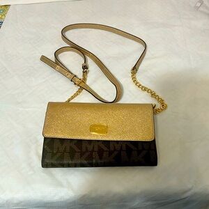 Gently used brown MK logo bag